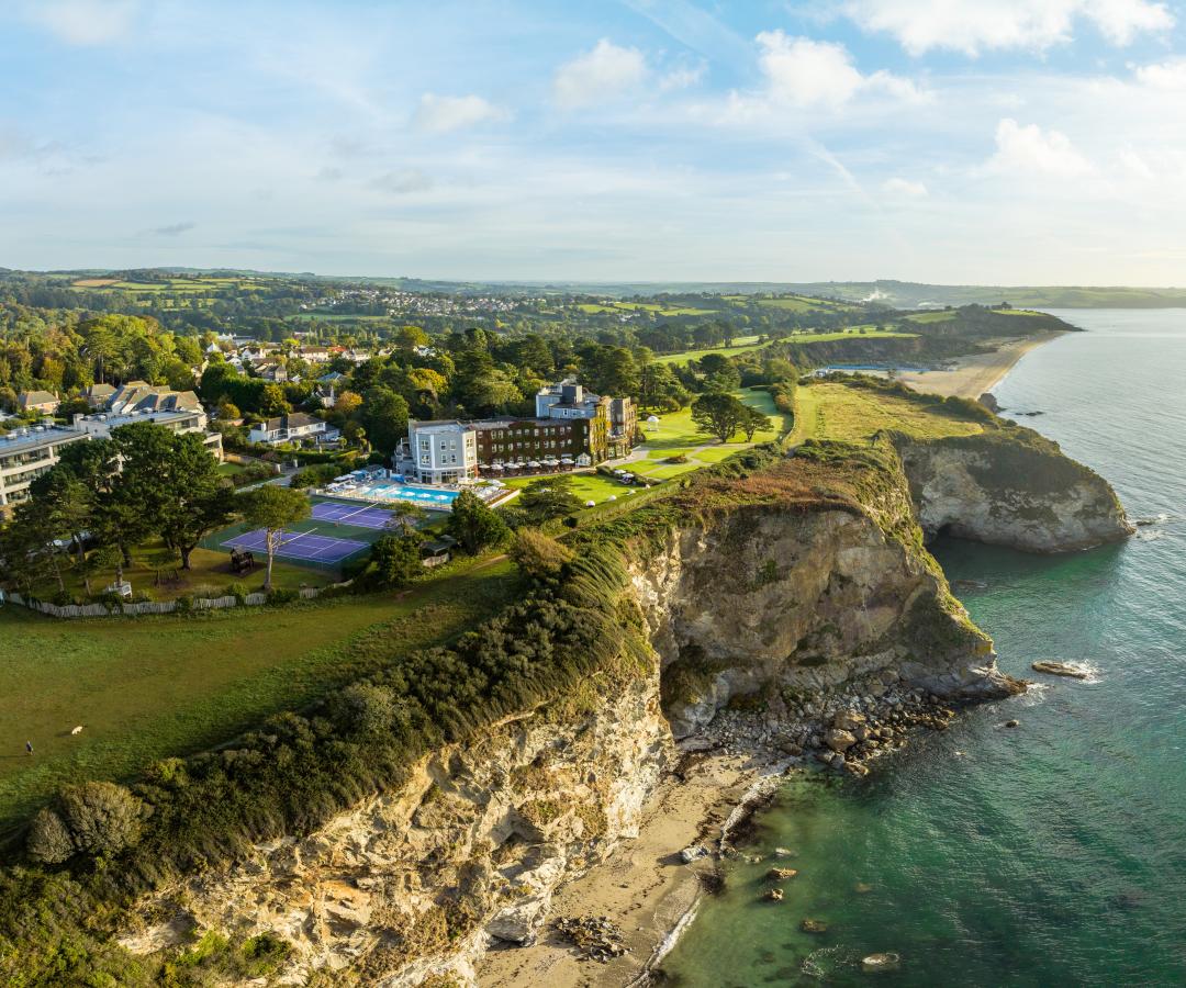 Coastal shot of The Carlyon Bay Hotel in Cornwall showing the coastline along the hotel