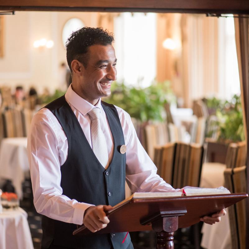 Restaurant manager welcoming guests