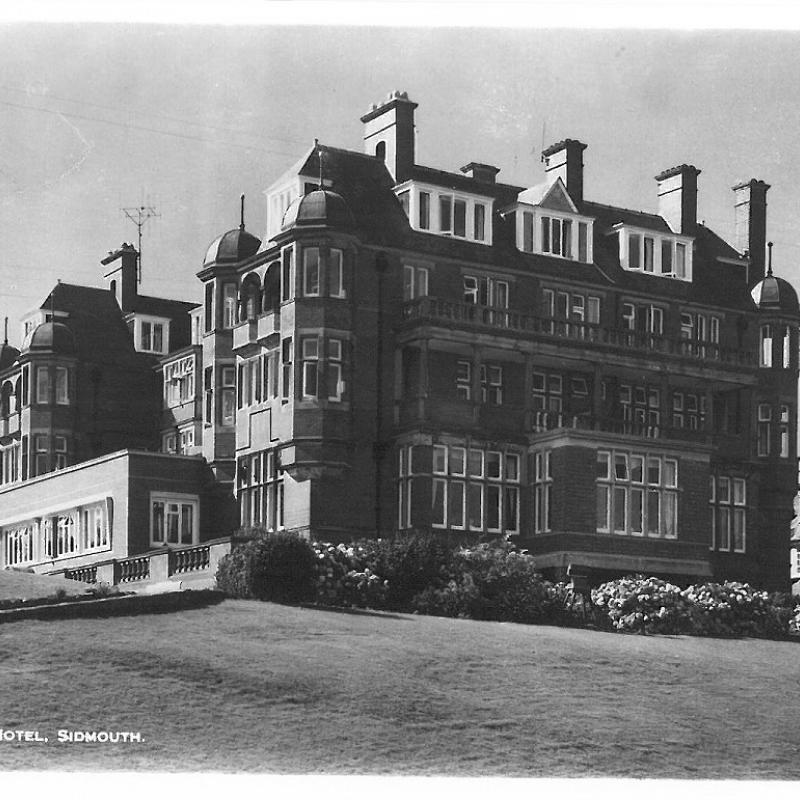 An old black and white postcard of the Victoria hotel in Sidmouth